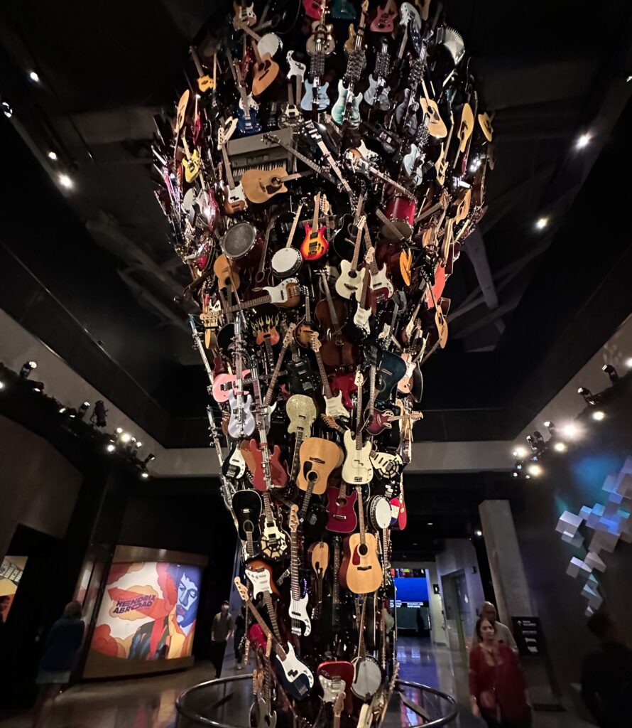 sculpture of guitars at the museum of pop culture